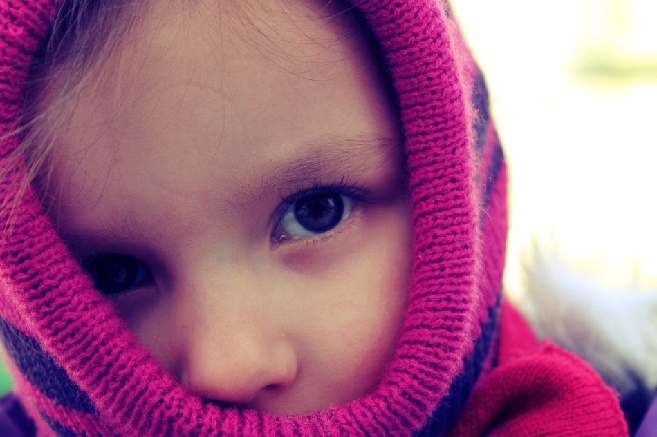 portrait of a little girl in a winter hat