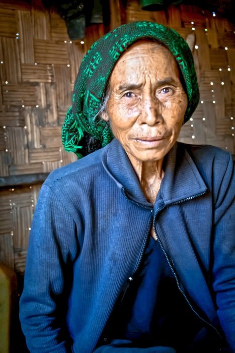 elderly Vietnamese woman in green headscarf