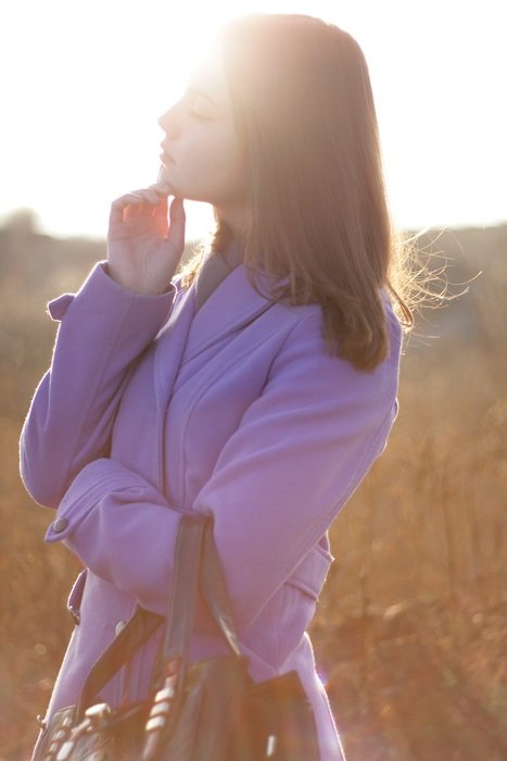 beautiful girl on a background of the spring sun
