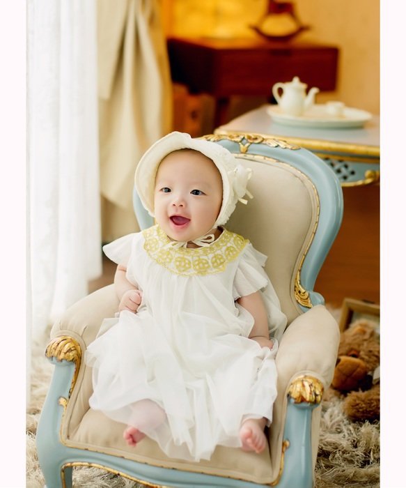 baby girl in the armchair