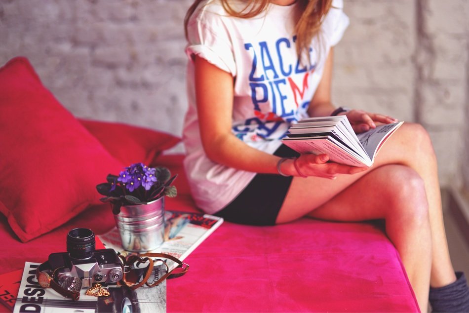 girl legs and book and camera