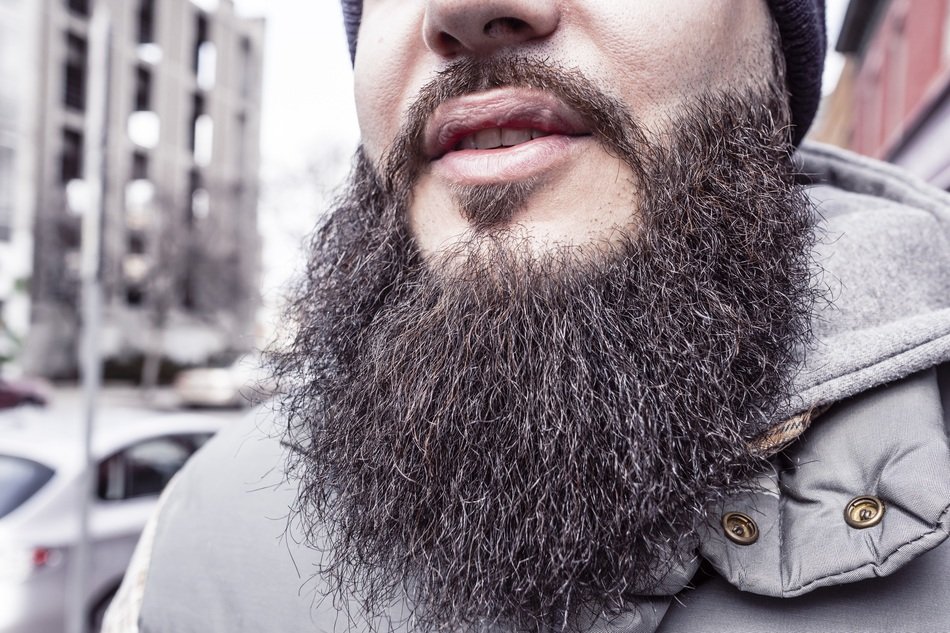 black bearded man in the city