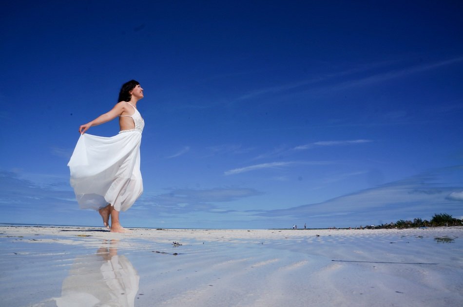 girl in a white dress on the Caribbean