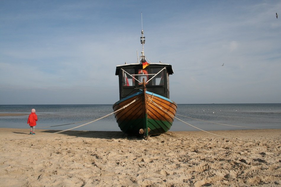 fishing boat on a sandy beach