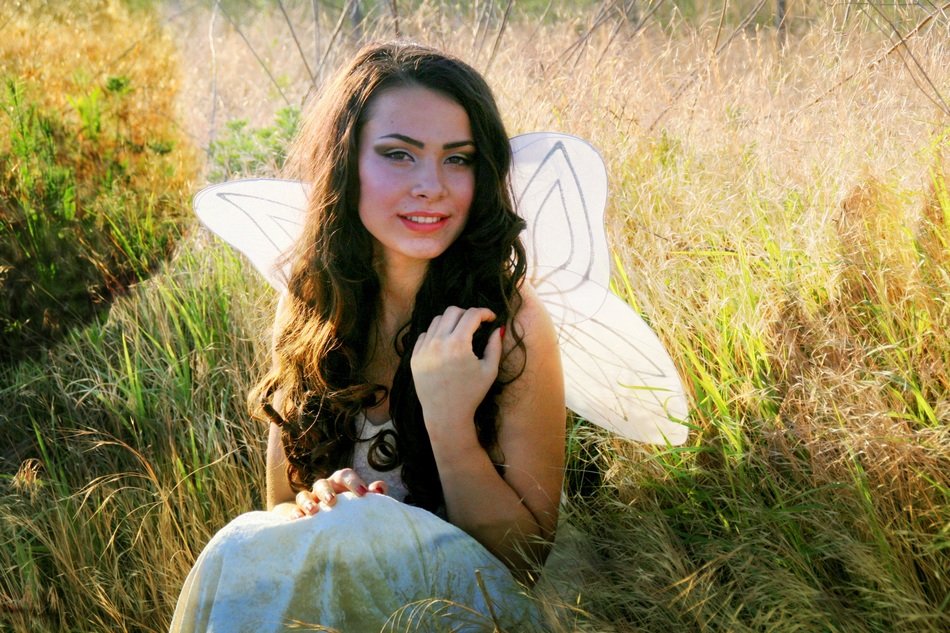 girl posing in fairy wings
