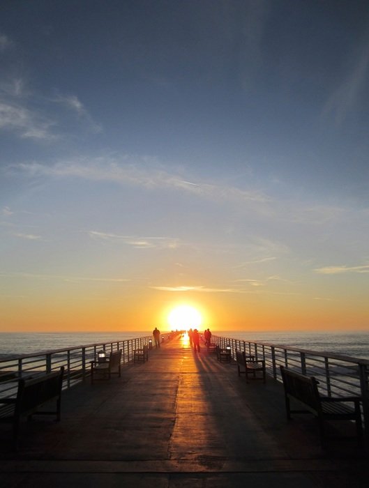 sunset at the end of the pier