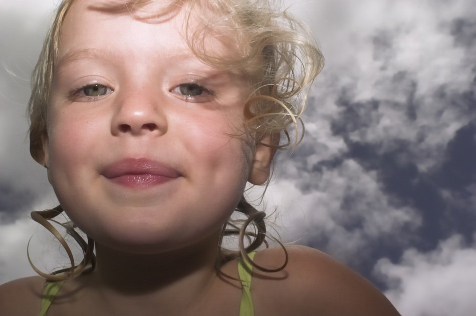 portrait of a girl on the sky background