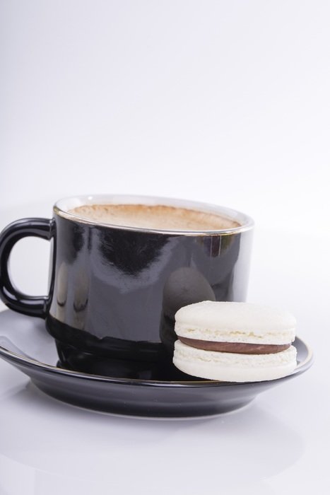 cup of coffee with macaroon