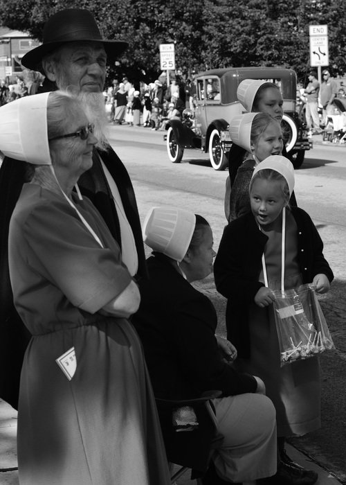 family in hats on parade