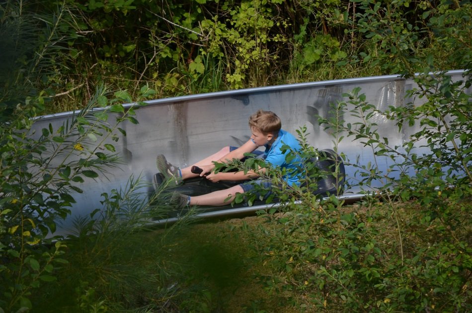 boy slides on a sleigh