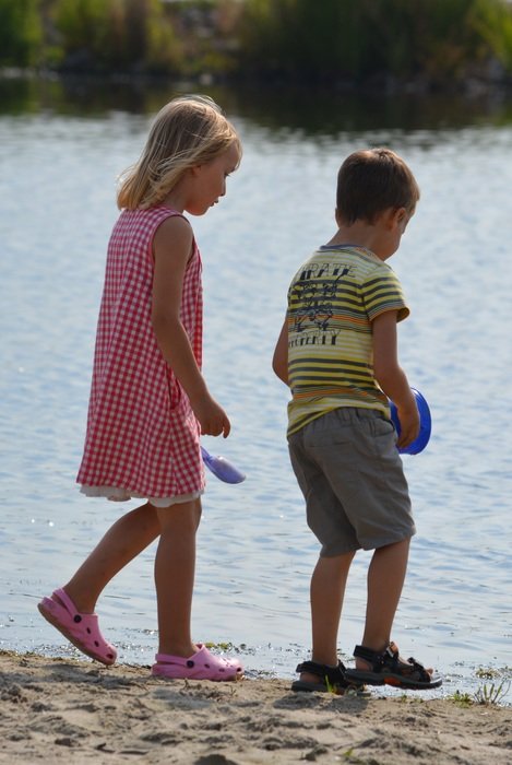 children on the beach on a sunny day