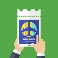 Mens hands holding tablet and booking tickets online