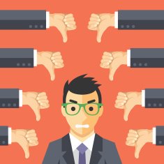 Angry businessman and many hands with thumbs down