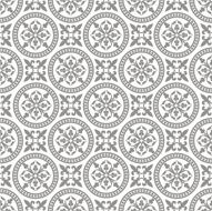 Gray pattern of circles and floral shapes on white