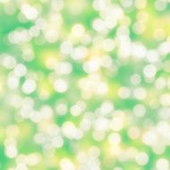 Blurred lime green multicolor bokeh dots