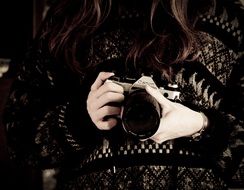 Photographer is holding the canon camera