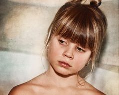 portrait of a thoughtful girl with a beautiful haircut
