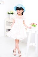 asian child in a white dress