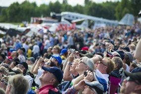 panoramic view of a crowd of people on an air show