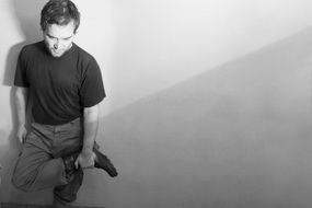 monochrome photo of posing beautiful man