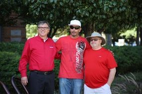 three colleagues in red