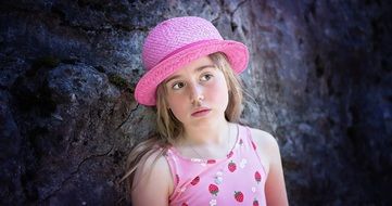 child in a pink hat