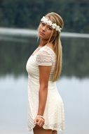 Pretty girl on a lake bank