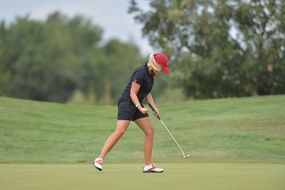 girl is playing Golf