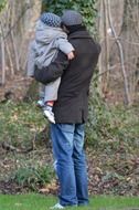 dad with baby in the park