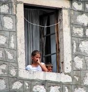 children are looking out of the window