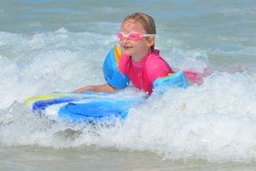 Little girl on the waves