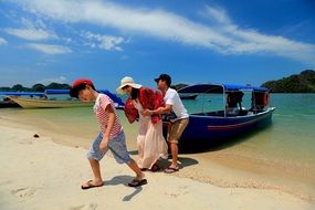 family at the beach in malaysia, langkawi