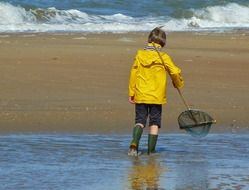 little fisherman on the coast of the north sea