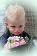 incredibly beautiful child with bouquet