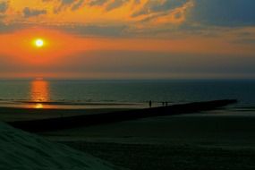 sunset mirroring sea