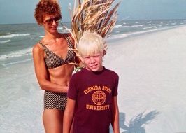 picture of mom with a baby on the beach