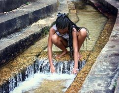 young girl on the creek