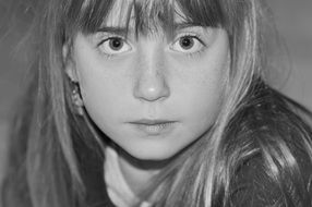 Black and white portrait of a girl with blond hair