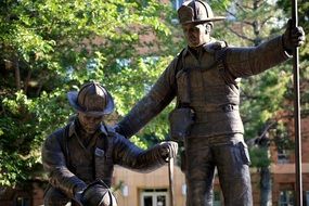statue of two firemen