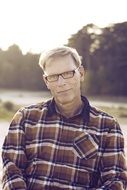 portrait of an old man in chequered shirt