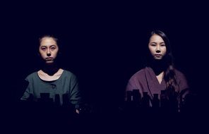 Pensive looks of Asian girls on a black background