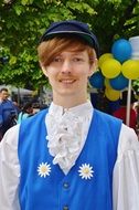 a young man in national costume in Sweden