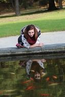 girl mirroring on water