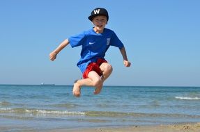 child athlete on a sunny beach