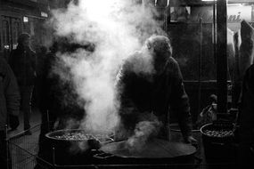 people cook on the street at night