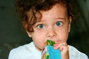 blue-eyed child with curly hair