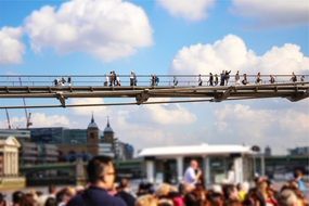 People are walking on the bridge