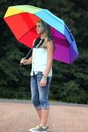 Pretty young blonde girl with the umbrella