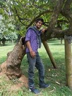 young male on a background of tree