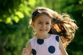 the running girlie with long hair in dress